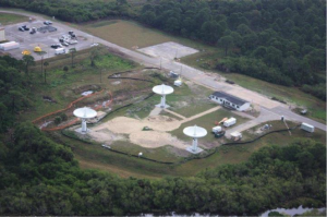 Overhead shot of the KaBOOM site at the Kennedy Space Center.  It is comprised of 3-12m diameter antennas.  The operations center is seen just to the right of center. Spacing between the antennas is 60m.